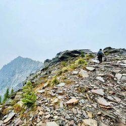 person hiking on Scotchman peak Idaho.