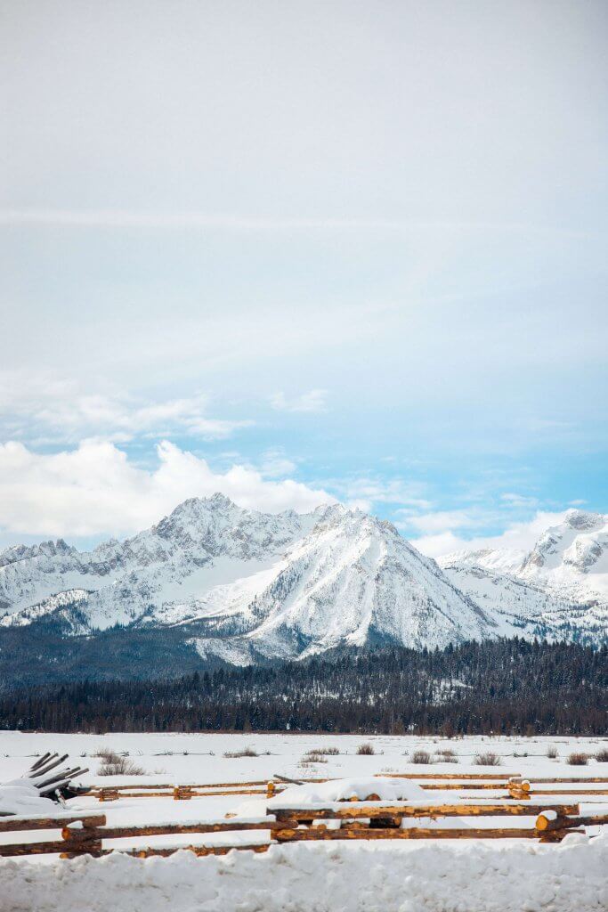 Scenic byway view of snow dusted mountains.