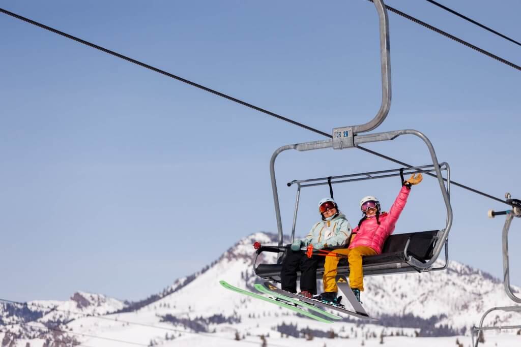 two women on chairlift on Dollar Mountain Sun Valley