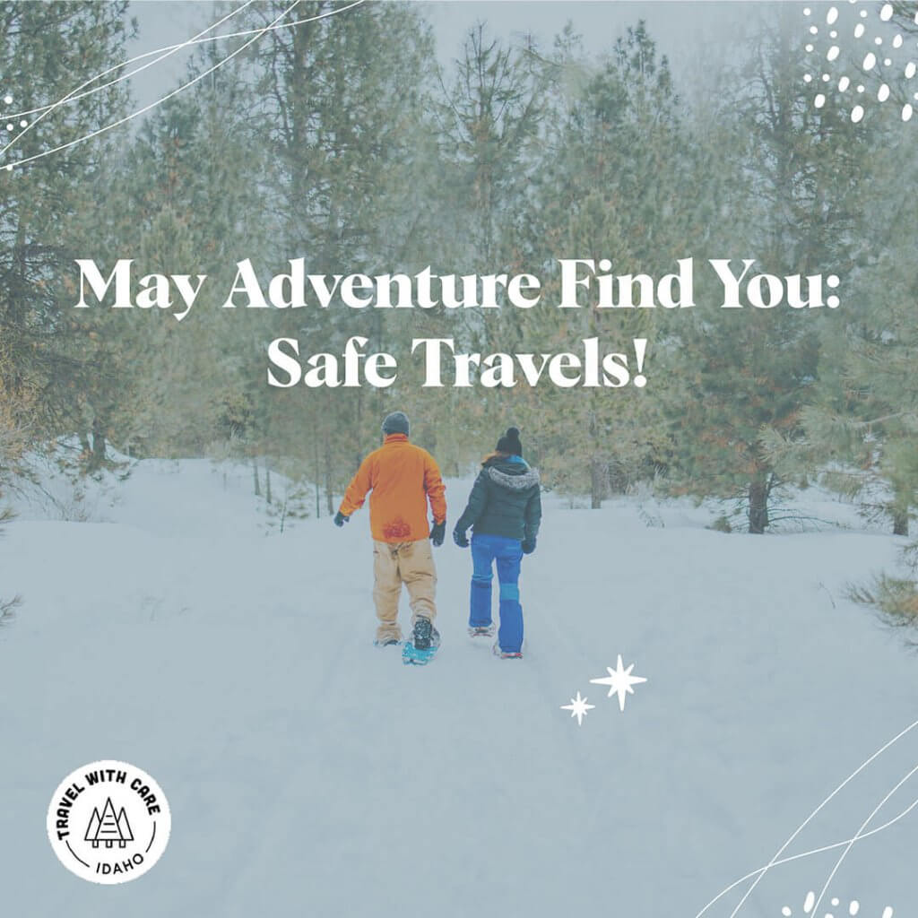 Two snowshoers in winter gear enjoy the Idaho trails.