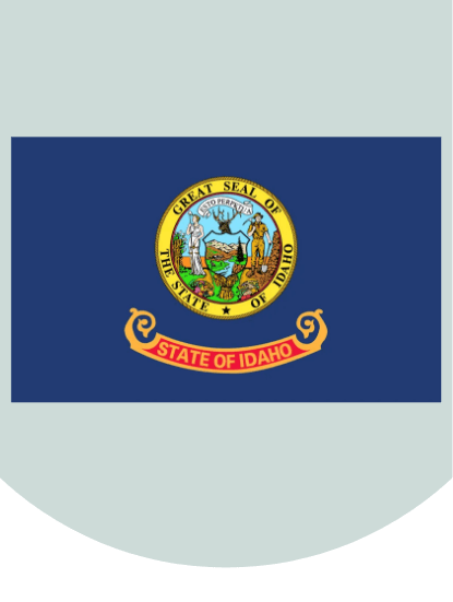 An illustration of the blue Idaho state flag showing the state seal above a banner that reads state of Idaho.