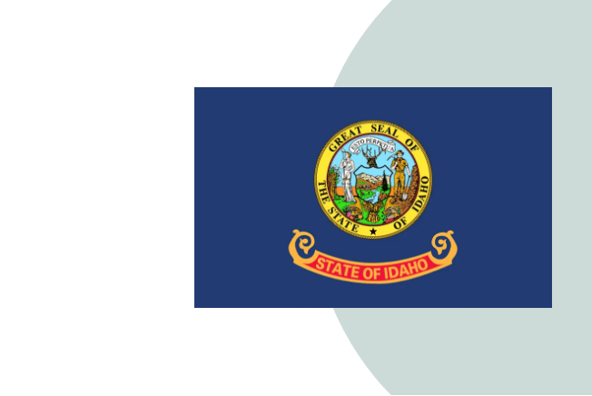 An illustration of the blue Idaho state flag showing the state seal above a banner that reads state of Idaho.