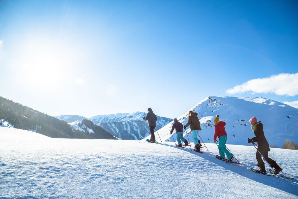 A family snowshoes into the mountains of central Idaho.