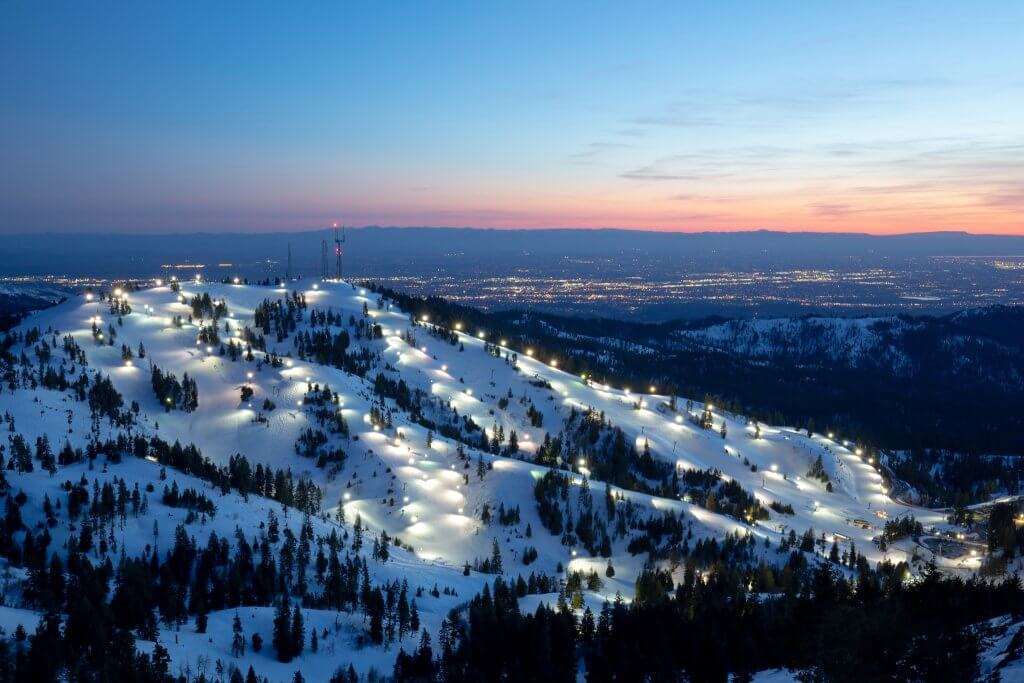 Bogus Basin at sunset with the Treasure Valley in the background of the frontside of the mountain.