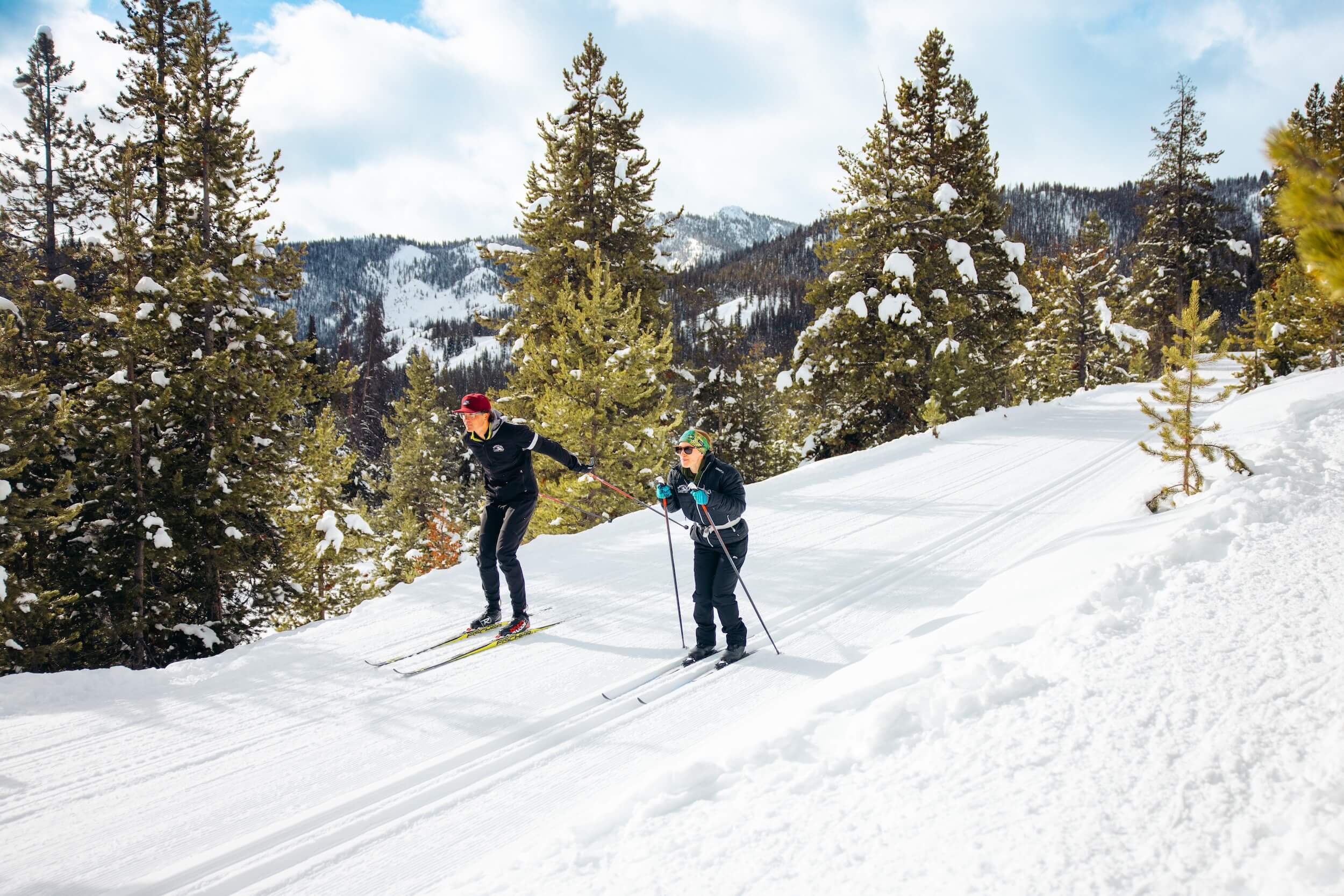 A couple goes cross-country (Nordic) skiing into the Idaho landscape at Galena Lodge.