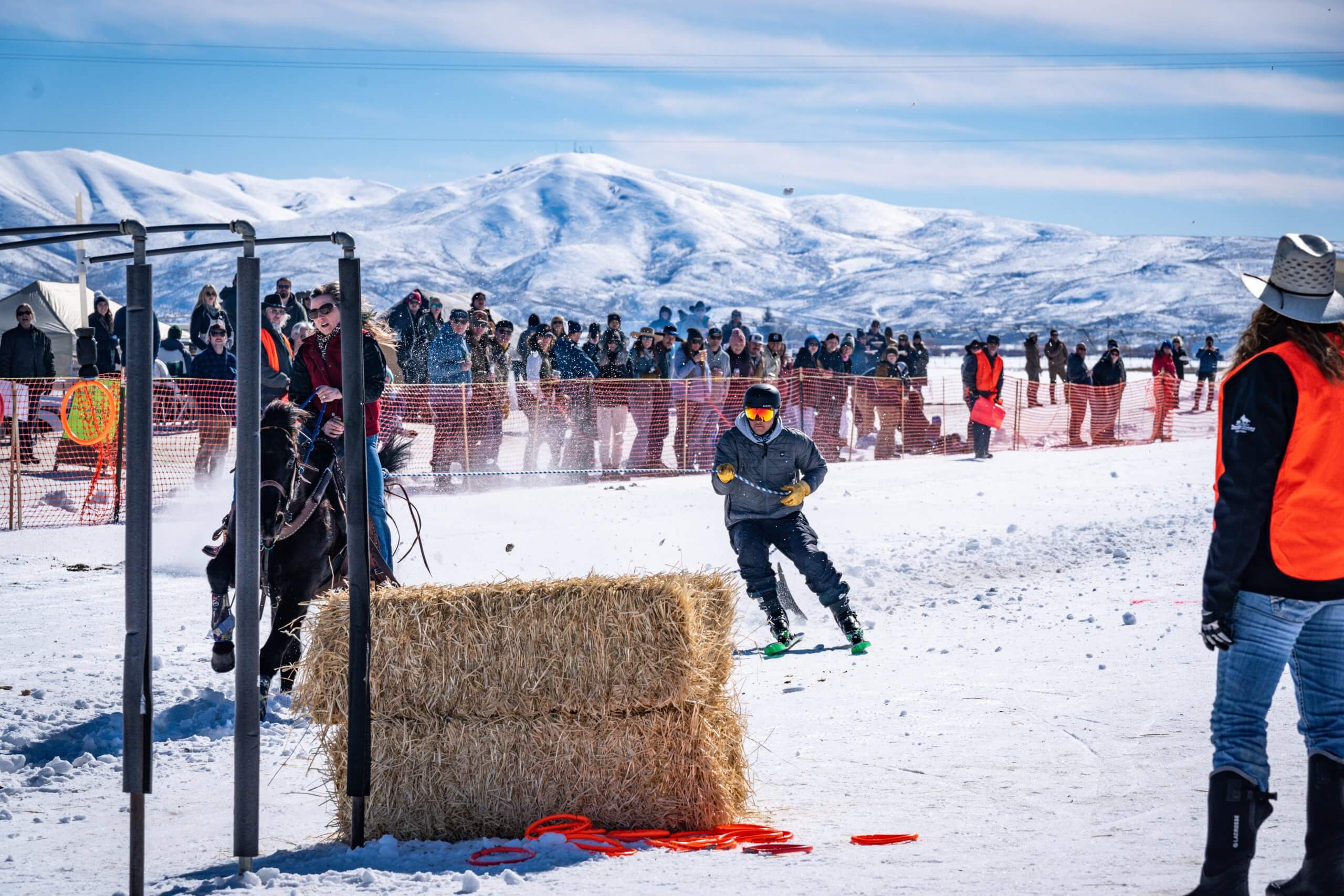 skier avoids obstacle at skijoring event