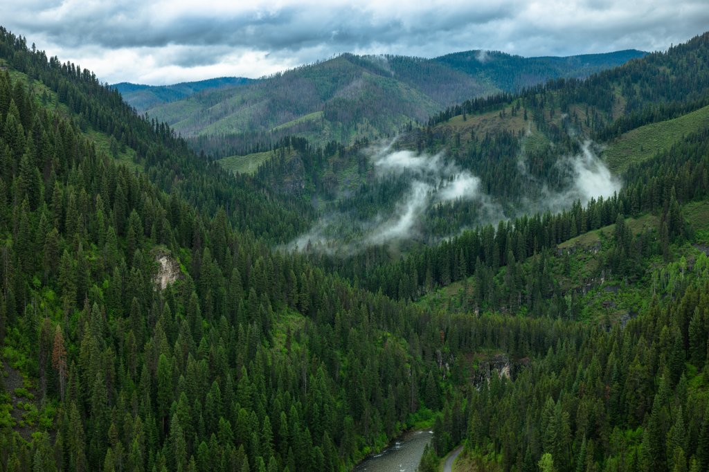 Fog drifts through forested ridges above the St. Joe River in North Idaho.