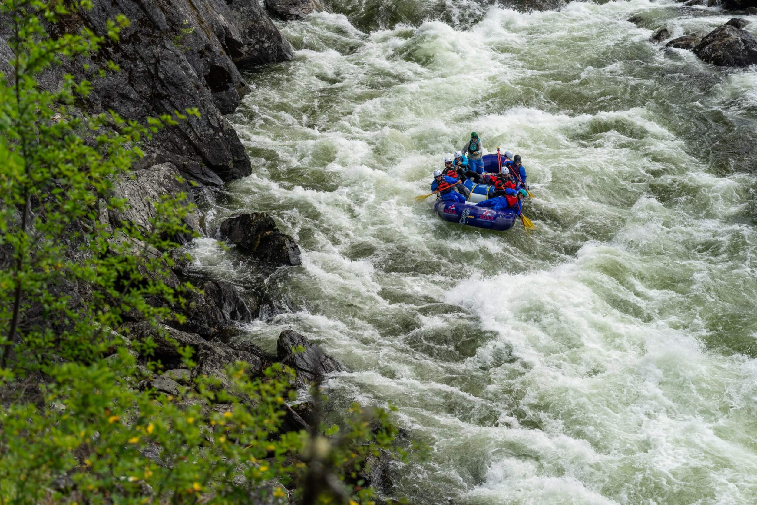 SOAR Northwest rafting group descends a narrow rapid on the Selway River, seen from above.