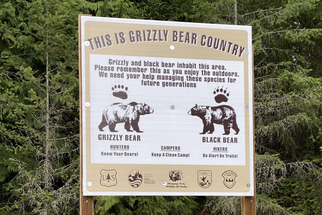 Travel With Care: Safety in Bear Country A sign encouraging hikers and hunters to be mindful of Grizzly and black bears in Idaho.