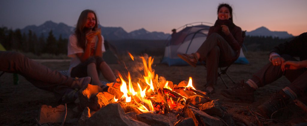 People gather around a campfire in Idaho.