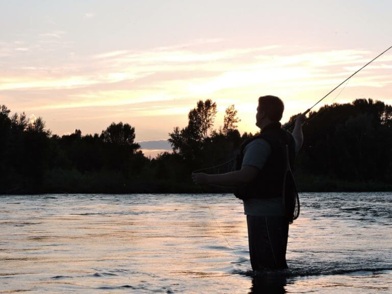 man fishing in eastern Idaho river