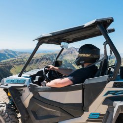 person rides on ATV