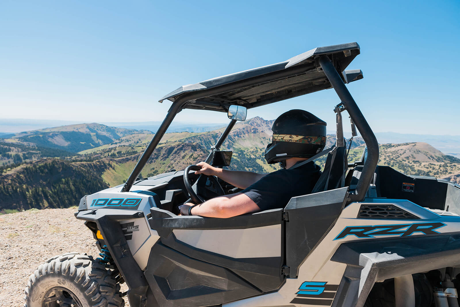 person rides on ATV