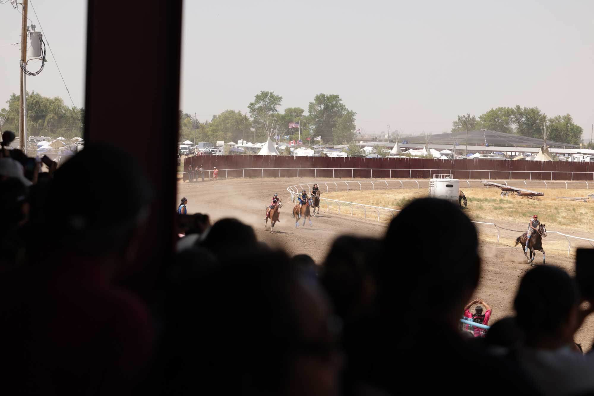 Riders compete at the Indian Relay Race in Fort Hall.