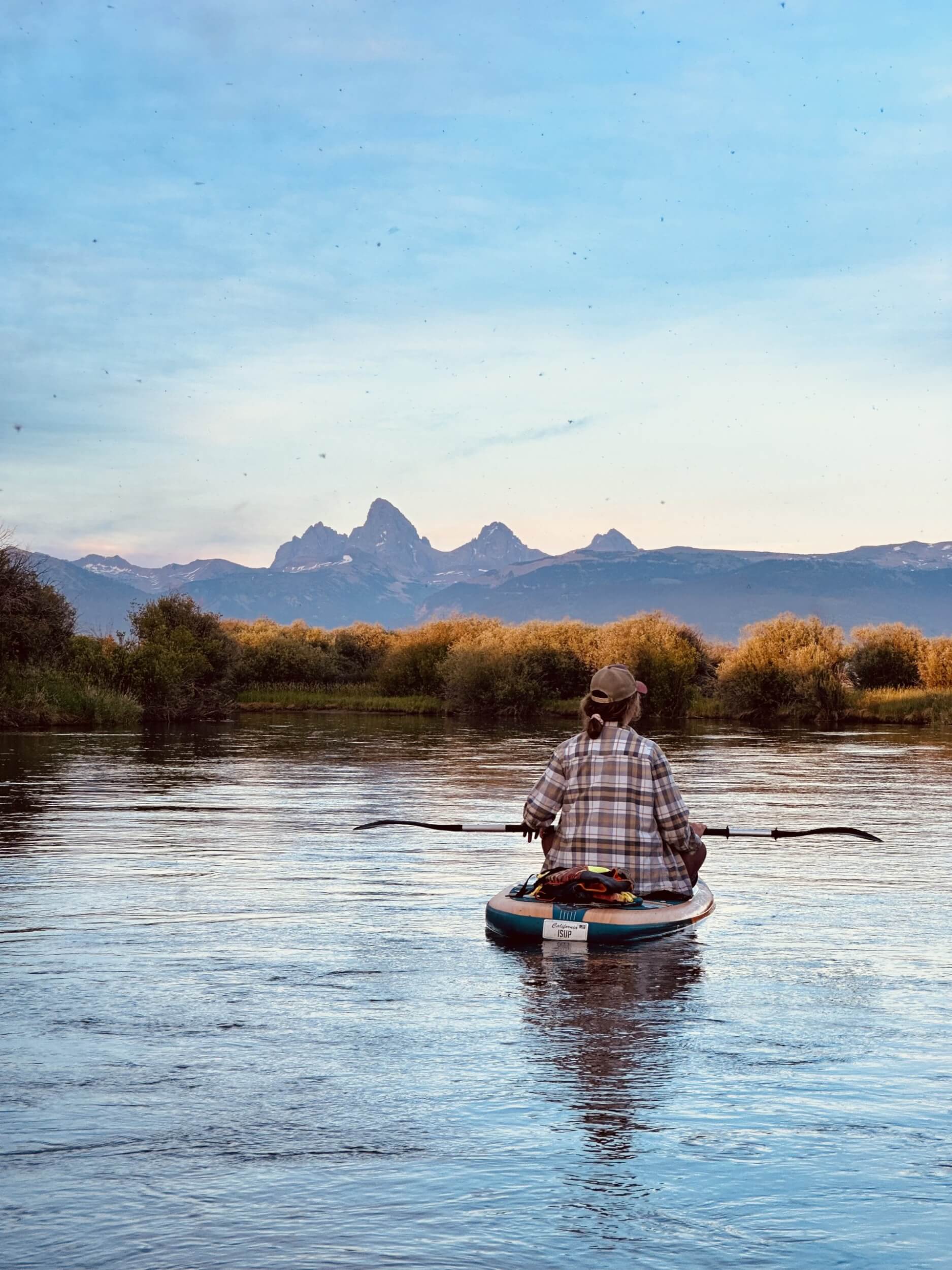 woman floats on Teton River. 