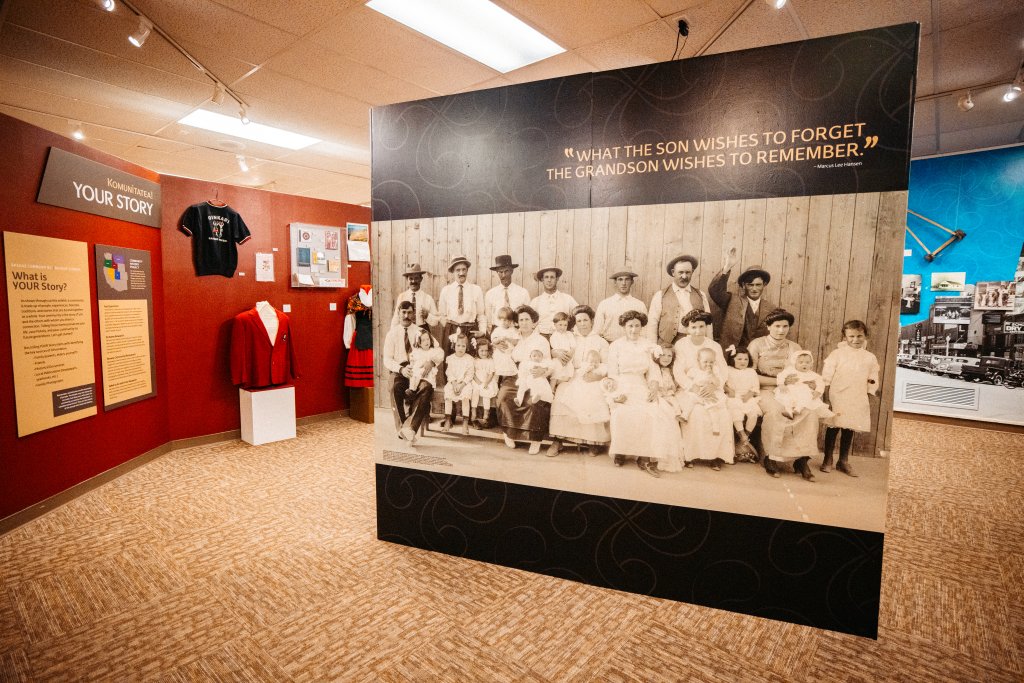 Museum exhibits with historic photographs and clothing inside the Basque Museum and Cultural Center.