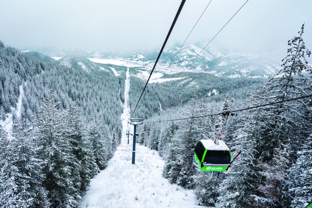 A neon green ski lift at Silver Mountain Resort.