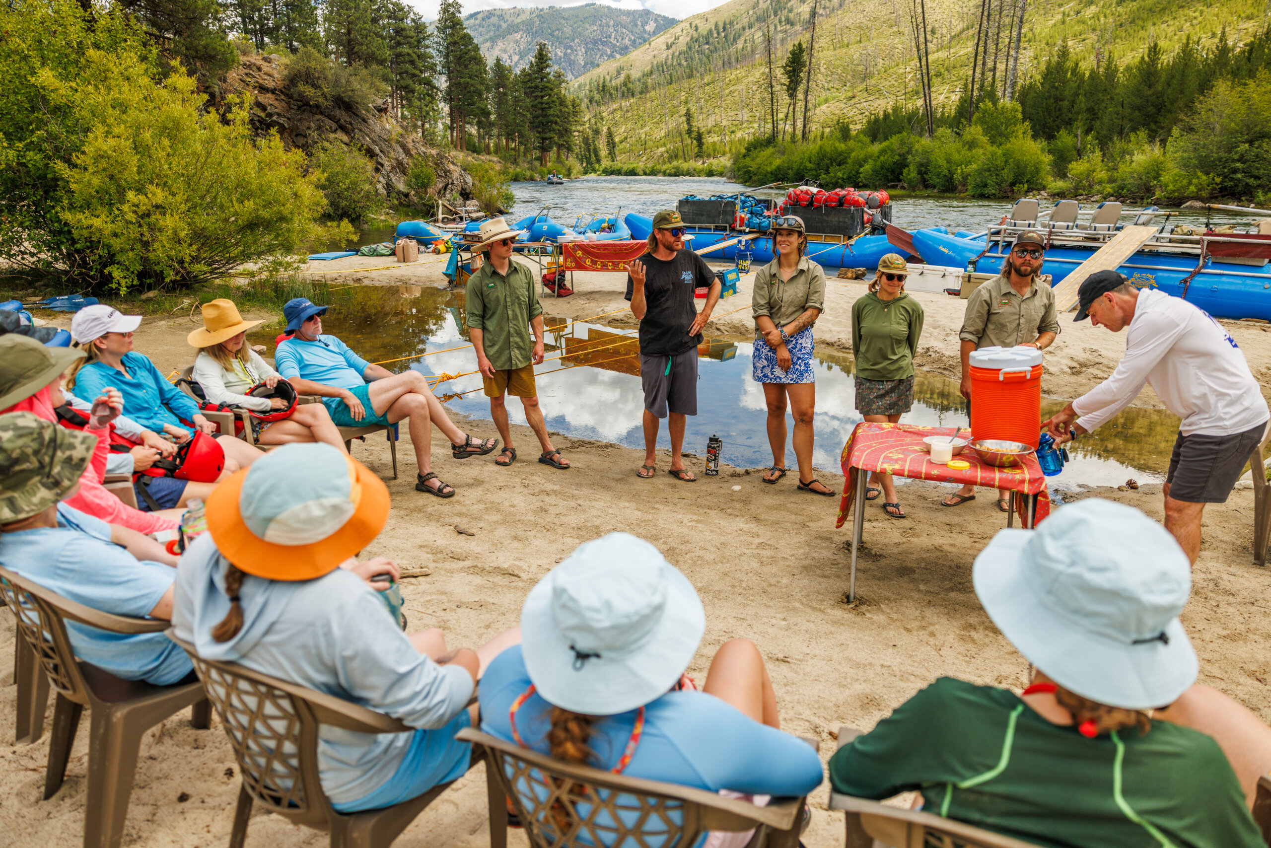 group of people on riverbank middle fork. 